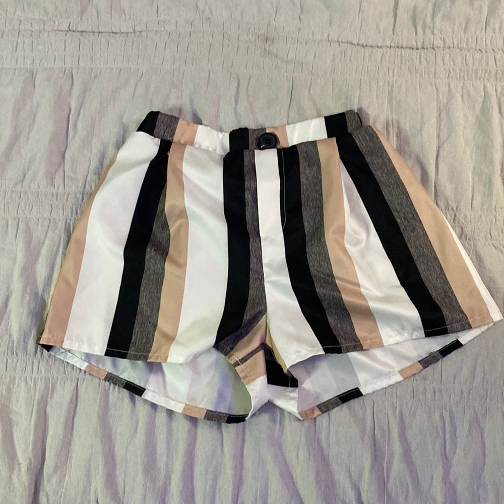 Black,grey,tan,and white shorts